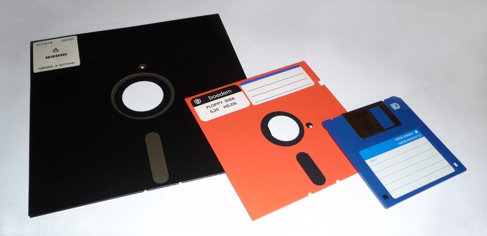 Three floppy disks of varying sizes.